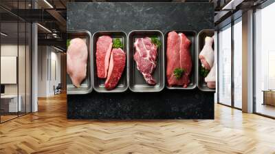 Set of fresh raw meat: veal, chicken, pork. On a black stone background. Organic food. Wall mural