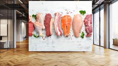 Set of raw meat steaks salmon, beef and chicken on a white wooden background. Top view. Wall mural