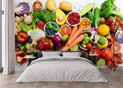 Vegan food banner. Fresh vegetables and fruits and berries on a white wooden background. Free space for your text. Wall mural