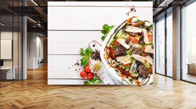 Vegetable salad with beef and parmesan cheese. Top view. free copying space. Wall mural