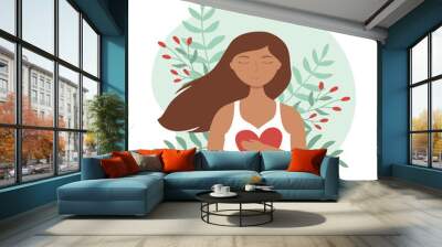 Young woman with closed eyes hugs herself. Mental health, zen, harmony concepts. Body positive, self care, love yourself Wall mural