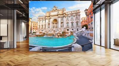 Trevi Fountain in Rome, Italy. Ancient fountain. Roman statues at piazza in old medieval city among traditional italian houses and street lamps. Famous landmark. Touristic destination for vacation. Wall mural