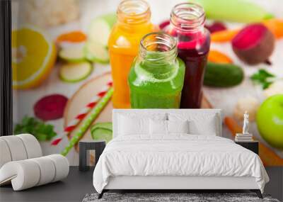 Freshly squeezed vegetable juice in bottles, useful vitamin cocktail, detox diet, selective focus Wall mural