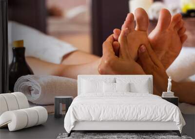 Massage of human foot in spa salon - Soft focus Wall mural