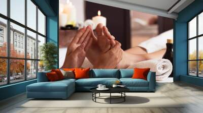 Massage of human foot in spa salon - Soft focus Wall mural