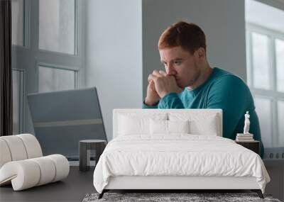 Business man Having Headache While Working Using Laptop Computer. Stressed And Depressed man Touching Head, Feeling Pain While Sitting At Wooden Tabl, Work Failure Concept Wall mural