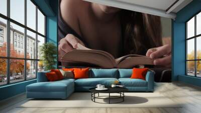 Sexy Young Girl Reading Book Lying on Bed Wearing a Blue Robe Wall mural