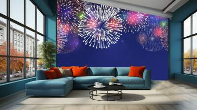 Fireworks on twilight background vector illustration. Bright salute explosion with glowing effect isolated on dark blue.
 Wall mural