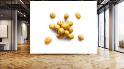 Closeup of a pile of fresh organic potatoes from the garden isolated on a white background from above, top view Wall mural