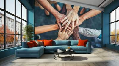 Diverse group of people joining hands together in a circle showing teamwork and unity Wall mural