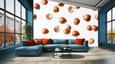 Flying in air hazelnuts isolated on white background. Falling hazelnuts Wall mural