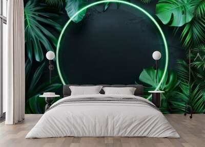 Tropical leaves with round neon frame for background on black. Fluorescent summer tropic background Wall mural