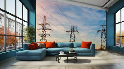 Electrical power lines as sun sets in background Wall mural