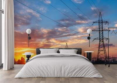 high-voltage lines against the background of electrical distribution stations at sunrise. Wall mural