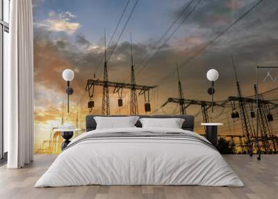 High-voltage power lines at sunset or sunrise. High voltage electric transmission tower Wall mural