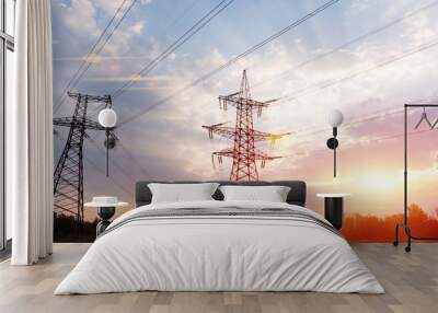 High-voltage power lines at sunset or sunrise. High voltage electric transmission tower Wall mural