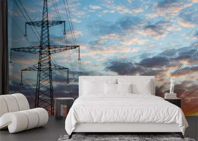 Silhouettes high voltage electric pylon in sunset background Wall mural