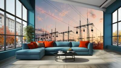 The silhouette of the evening electricity transmission pylon. Power transmission from a power plant to a city. Wall mural