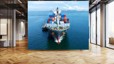 Aerial front view of cargo ship carrying container and running with tug boat for import export goods from cargo yard port to custom ocean concept freight shipping by ship . Wall mural