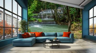 beautiful water fall and Leaf natural leaves and stream green forest in the mountain concept back ground cover page environment ecology or nature wallpape Wall mural