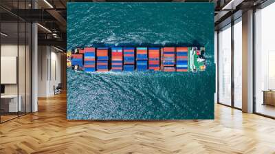 Cargo container ship carrying container and running out international container port customs shipyard sea port concept smart logistic service. Wall mural