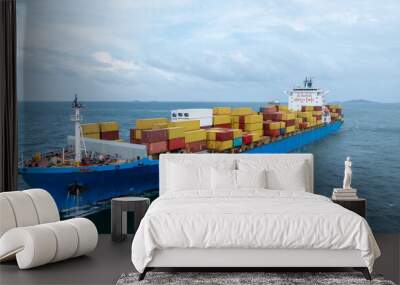 Side view Cargo container ship carrying container and running in the ocean near international container port customs shipyard sea port concept smart logistic service. transportation logistics trading Wall mural