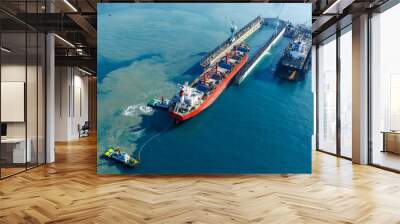 Tug boat Draging cargo container ship to dry dock concept maintenance service working in the sea. Insurance and Maintenance Cargo Ship concept. Freight Service maintenance Insurance Wall mural