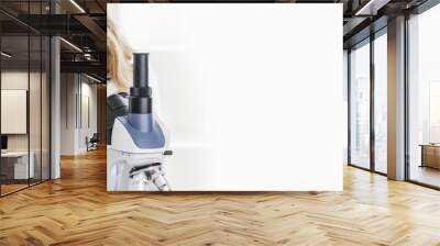 Female doctor looking through a microscope Wall mural