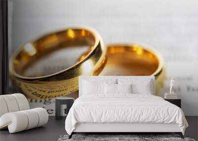 Golden wedding rings on bible book Wall mural