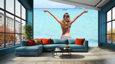 Happy woman on beach Wall mural