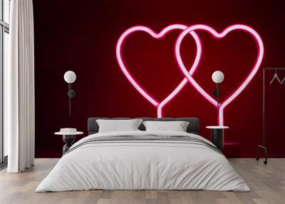 Two glowing pink neon hearts Wall mural