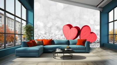 Two red hearts on glittering background Wall mural