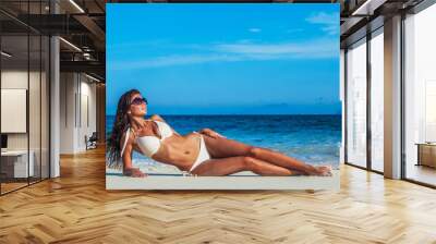 Woman in bikini at tropical beach Wall mural