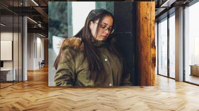 A girl with glasses posing Wall mural