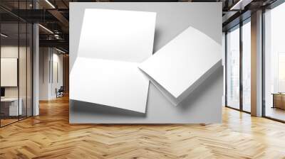 Blank half-folded booklet, postcard, flyer or brochure mockup template on gray background Wall mural