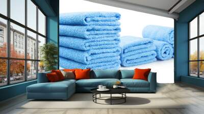 Clean blue towels, isolated on white background Wall mural