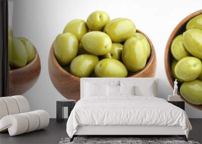 Collection of wooden bowls with  green olives, isolated on white background Wall mural