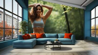 Happy athletic girl doing fitness outdoors Wall mural