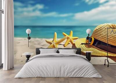 Hat and starfish on a sandy beach against the backdrop of a beautiful sea. Beach holiday concept. Copy space Wall mural