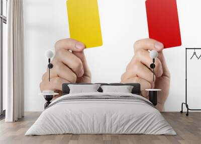 Male football (soccer) referee hand holding yellow and red cards, isolated on white background Wall mural