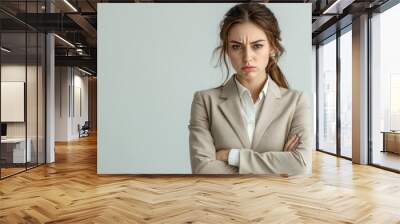 Angry young businesswoman in beige suit isolated on white background with copy space, professional Wall mural