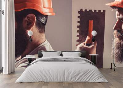 Builder in helmet, hammer, handyman, builders in hardhat. Bearded man worker with beard, building helmet, hard hat. Tool, trowel, man builder Wall mural