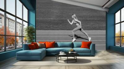 Sportswoman exercising in sport clothing, training, workout. Black and white Wall mural