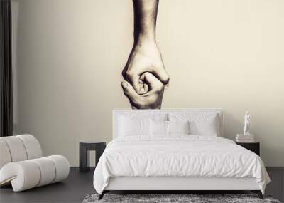 Two hands, helping arm of a friend, teamwork. Helping hand outstretched, isolated arm, salvation. Close up help hand. Black and white. Copy space Wall mural