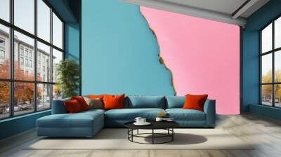 Turquoise and pink paper with burnt edges. Wall mural