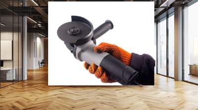 Worker's hand holds grinder on white background. Wall mural