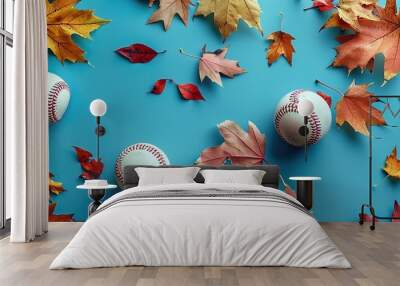 Flat Lay of Autumn Leaves and Baseballs on Blue Background, Capturing the Essence of Fall Sports Season with Scattered Foliage and Game Equipment Wall mural