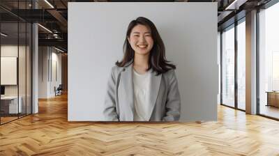 a young japanese businesswoman smiling at the camera Wall mural