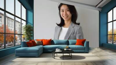 a young japanese businesswoman smiling at the camera Wall mural