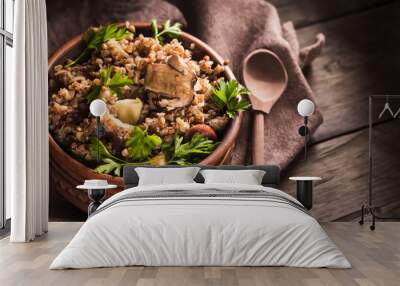 Bowl of buckwheat porridge with mushrooms Wall mural